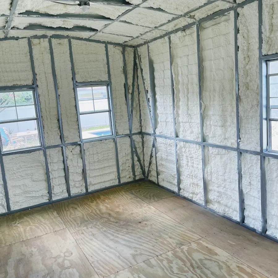 Closed-cell spray foam insulation applied to wall cavities in a residential project in Taylor
